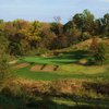 A view of green protected by bunkers at Far Oaks Golf Club