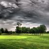 A cloudy view of the practice putting green at Rolling Hills Golf Club
