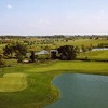 A view of green #18 with water coming into play from right at Odyssey Golf Course