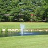 A view over the water of green at Quail Meadows Golf Course