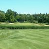 A view of green #9 flanked by bunkers at Seven Bridges Golf Club