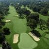 Beverly CC #18: A grand, sweeping dogleg right that ends with a magnificent clubhouse view, demanding a long tee shot favoring the left side of the fairway. If all is well after the second shot, the player faces a short iron into the huge green.