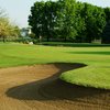 A view of green with bunker in foreground at Fox Bend Golf Course
