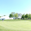 A view of green at Bittersweet Golf Club with white tent for special events in background