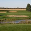 A view of green at Shambolee Golf Club with bunkers in background