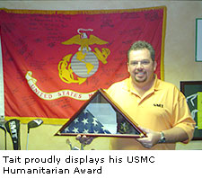 Tait proudly displays his USMC Humanitarian Award